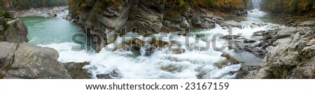 Autumn mountain waterfall panorama