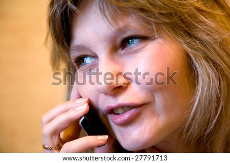 talking by phone woman facial close-up portrait (indoor)
