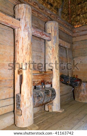 Ukrainian historical peasant dwelling interior with wood wedge oil-mill