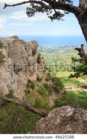 Yalta city view from slope of Aj-Petri Mount and cross on rock (trail Botanical, Crimea, Ukraine)