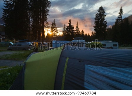 Camping site in Italian dolomites. Summer sunset view.