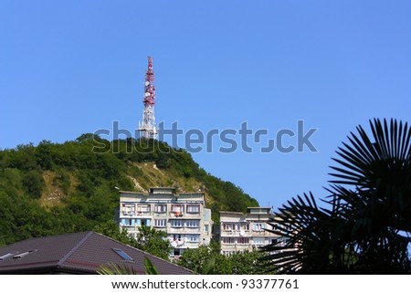 Telecommunication tower and buildings in mountains. The Black Sea coast of Caucasus