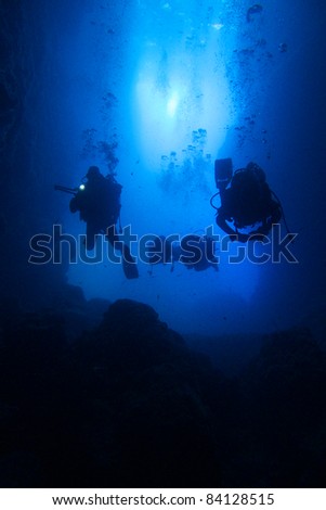Scuba-divers in a cave