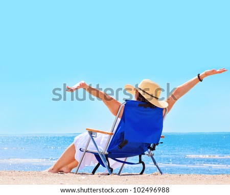 Pretty woman at the beach in summer portrait