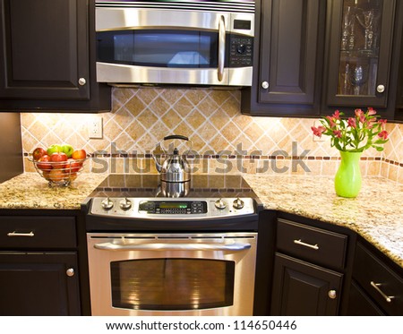 Modern domestic kitchen with steel oven and microwave