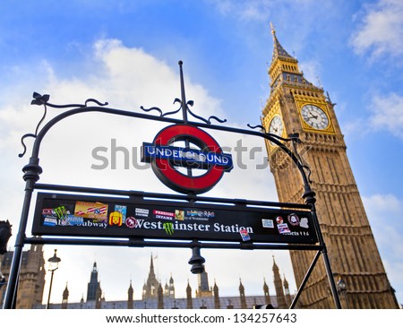 LONDON, ENGLAND Dec 21: London Underground subway sign in front of the famous Big Ben clock at Westminster on December 21, 2012 in London, United Kingdom.