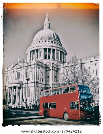 Red London bus in front of St Paul\'s Cathedral with added vintage filters