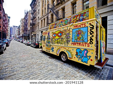 NEW YORK, USA - JUNE 29th 2014: Street artist truck on the famous Mercer cobbled street in Soho district of lower Manhattan