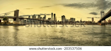 Manhattan and Brooklyn Bridges and Manhattan skyline At Night