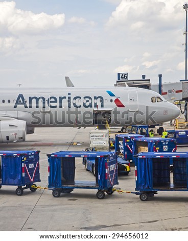New York, USA - June 19th, 2015: American Airlines passenger jet being loaded at JFK airport in New York.