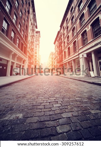 Cobbled Soho street in New York with added sun effect and Instagram filter
