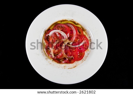 Fresh tomato and onion salad with seasoning