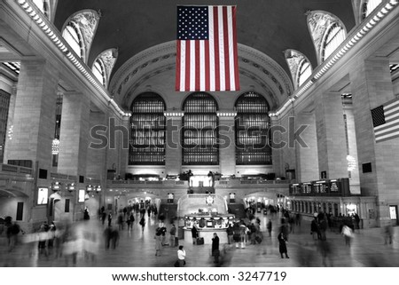 Commuters under the Stars and Stripes in Grand Central Terminal