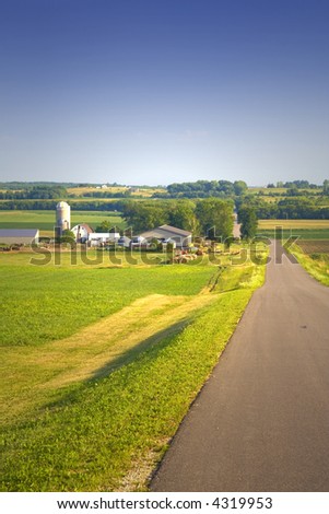 View of a farm under a blue sky
