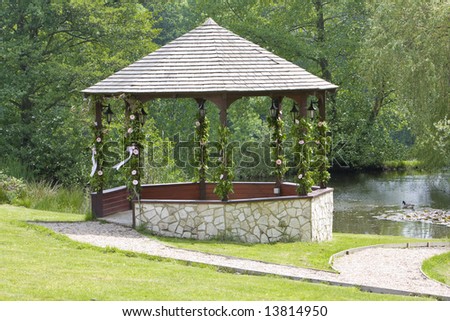 stock photo Sone wedding gazebo decorated with flowers and ribbons