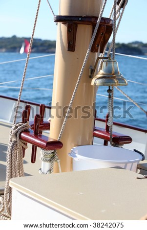 Old ships bell against mast