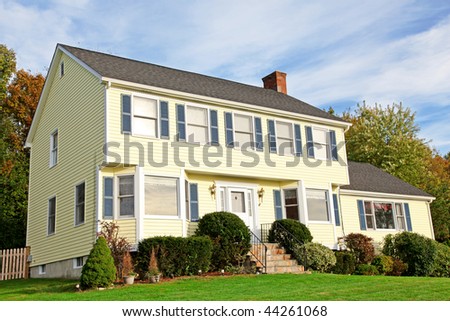 Yellow New England Style colonial house