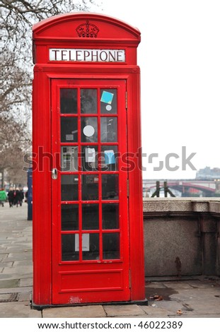 Red Telephone Box London next to River Thames