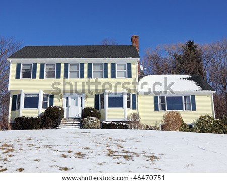 Traditional American colonial style house in winter