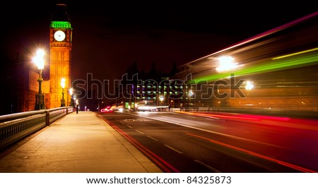 Westminster Bridge in London at night with Big Ben and bus