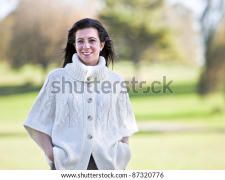 Pretty woman portrait with beautiful fall background