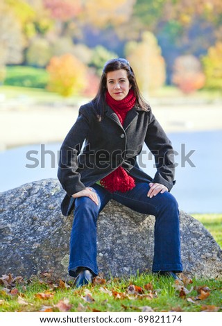 Pretty woman portrait with beautiful fall background