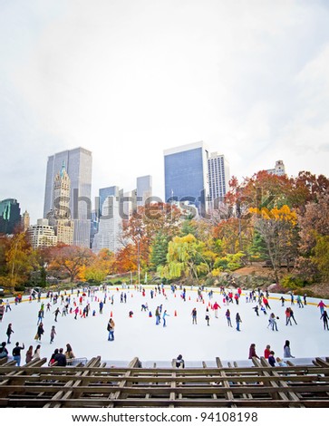 Ice skaters having fun in New York Central Park in fall