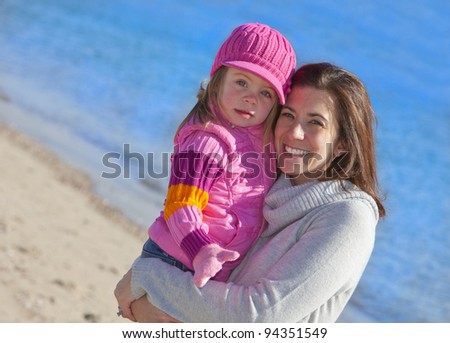 Mother and daughter outside at the beach