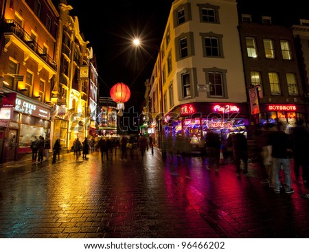LONDON- FEB 13: Tourists in London\'s famous Chinatown and Soho at night. Chinatown, London, Feb 13, 2012.