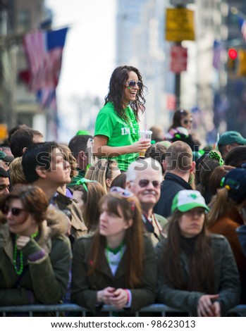 NEW YORK, NY, USA MAR 17: Crowds of people gather to celebrate at the St. Patrick\'s Day Parade on March 17, 2012 in New York City, United States.
