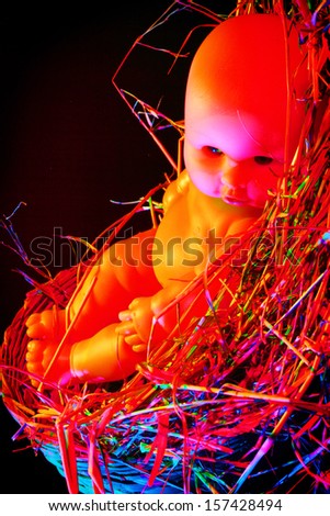 Doll was left in a pile of straw.