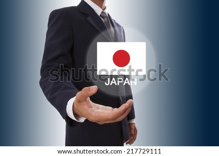 Businessman hand showing Japan Flag