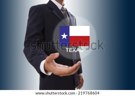 Businessman hand showing Texas Flag