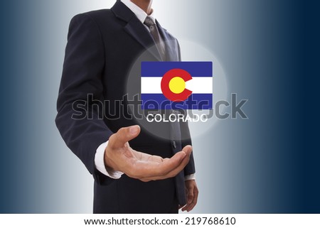 Businessman hand showing Colorado Flag