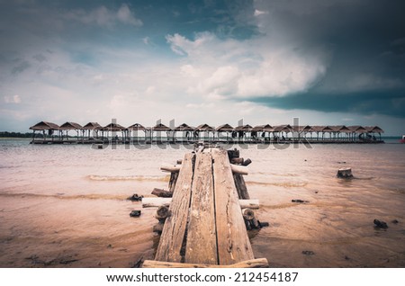 Wood cottage Water and sky in  the Reservoir embankment Sirinthorn Ubonratchatani Thailand vintage