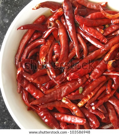 Red chilly dried Cayenne pepper in a white color bowl