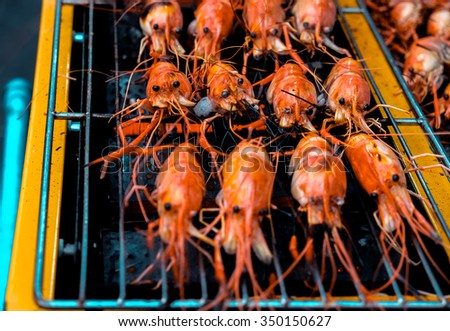 Grilled prawns on the electricity grill in fresh food market
