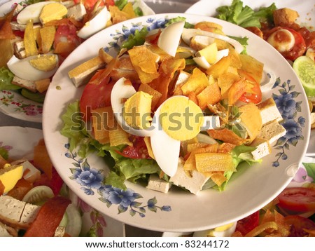 Salad thailand (Salad-khaek) - Indian food on white dish on red table