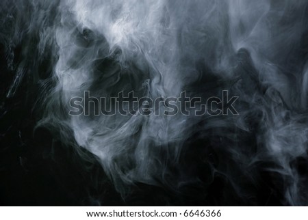 Appearance of cigarette smoke forming the shape of a skull.  Good for stop smoking ad, campaign, pamphlet, brochure or advertisement. Dry ice carbon dioxide gasses forming an image of a scary skull.