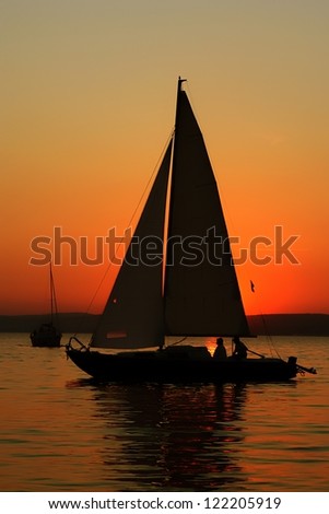 Sunset and boat with people