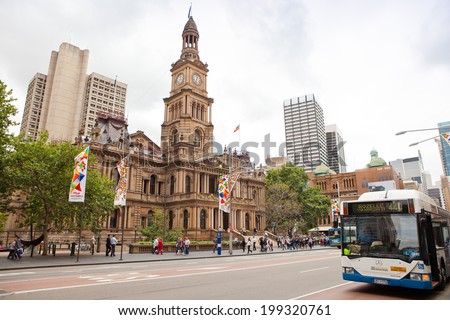 SYDNEY - MARCH 22: View of Sydney Town Hall and city\'s CBD building in the background on March 22, 2011 in Sydney, Australia. Built in the 1880s,the Town Hall is a landmark building of Sydney.