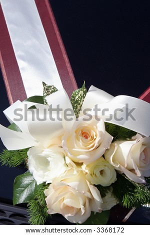 this is a wedding car decoration. flower bouquet on a wedding car.