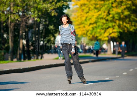 MOSCOW-SEPT.12: Unidentified girl roller skates near Gorky Park on Sept. 12, 2012 in Moscow.City government has built a new bicycle path on the embankment of the Moscow River for citizens recreation