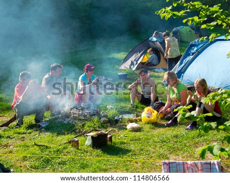 CRIMEA, UKRAINE - APRIL 29: Unidentified hikers rest in a tent camp on April 29, 2012 in Crimea Mountains, Ukraine. This place is very popular for outdoor activities for hikers from Russia and Ukraine
