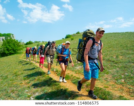 CRIMEA, UKRAINE - MAY 05: Unidentified hikers walk on a path on May 05, 2012 in Crimea Mountains, Ukraine. This place is very popular for outdoor activities for hikers from Russia and Ukraine