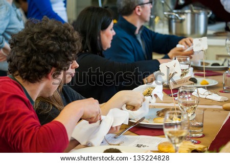 MOSCOW - APRIL 6: Unidentified people learn how to properly prepare and eat seafood at culinary master class \