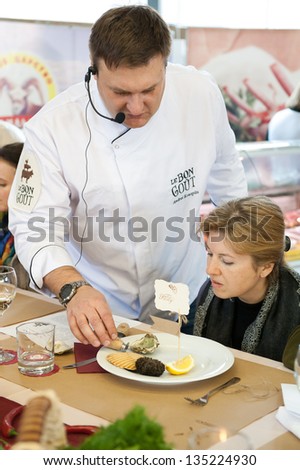 MOSCOW - APRIL 6: Chef Andrew Kuspits shows how to properly prepare and eat seafood at culinary master class \