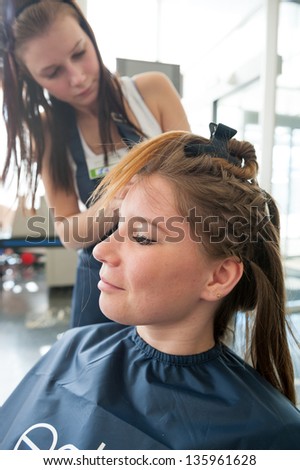 MOSCOW - APRIL 19: Unidentified orphan children, age 13-16, compete in hairdressing at the contest Young Master on April 19, 2013 in Moscow. Orphans were trained by charitable foundation Color of Life