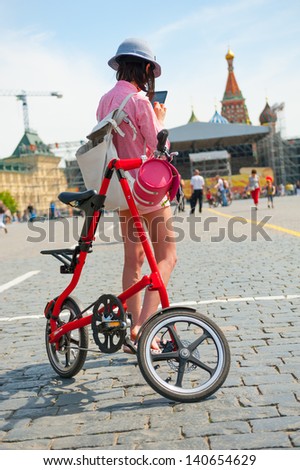 MOSCOW - MAY 19: Cyclists pose during the Day of the Uniform Bike Action on May 19, 2013 in Moscow. During this event many cyclists ride bicycles in an unusual wear and took part in the flash mobs