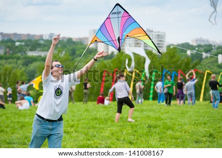 MOSCOW - MAY 25: Unidentified child flies kite at the kite festival in the park Tsaritsyno on May 25, 2013 in Moscow.